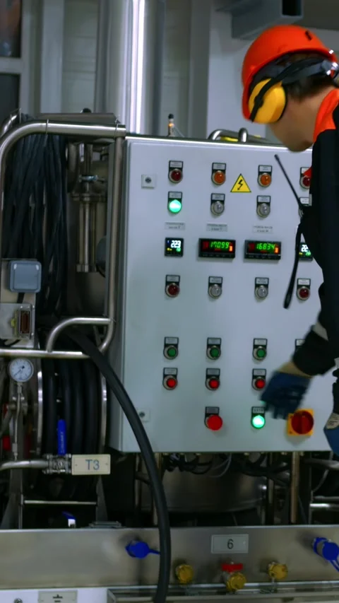 Operation engineer starts up equipment, verifying settings and system Stock Footage 287615442