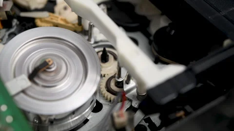 Operation of the film loading and unloading mechanism in a VCR. Stock-Footage 327975163