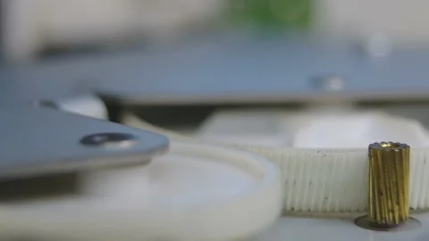 Operation of a gearwheel in the unit of the printer (macro, a side view) Video stock 85720545
