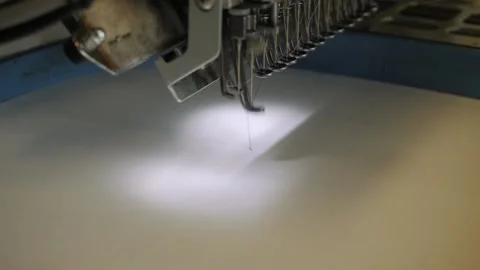 Operation of an industrial robotic sewing machine. Video stock 139494863