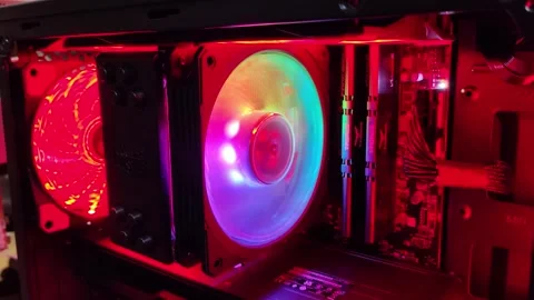 Operation inside custom-built desktop gaming PC with multicolored RGB LED light 스톡 동영상 302347152