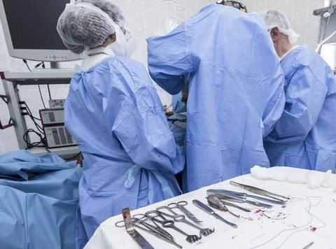 Operation, joint replacement doctors, surgeon, hands, tools, equipment Stock Photos
