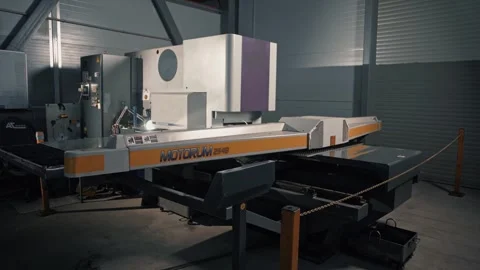 Operation of a large automated CNC coordinate punching press machine. Stock Footage 265509348