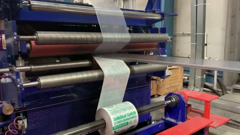 Operation of machine for applying film to plastic panels Stock Footage 231723423
