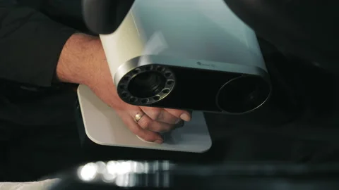 Operation of a manual 3D scanner. Close-up laser scanning of the car interior Stock Footage 229802656