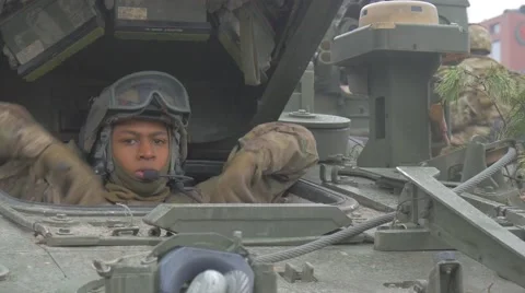 Operation of Nato Training Poland Afro-American Soldier in Helmet is Sitting in Stock Footage 61201700