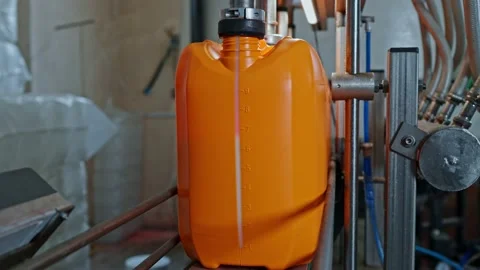 Operation of the paint bottling line Stock Footage 239860289