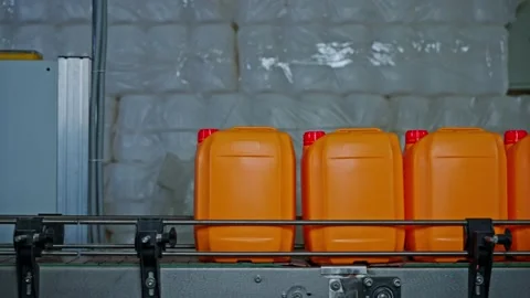 Operation of the paint bottling line Stock Footage 239860340