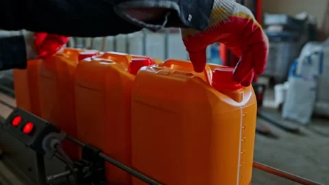 Operation of the paint bottling line Stock Footage 239860341