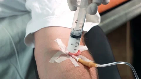 Before the operation, the patient is injected with a syringe of anesthesia Stock Footage 220804601