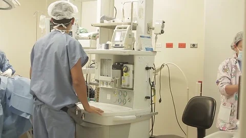 Operation room performing surgery on a patient's eye Stock Footage 70765324