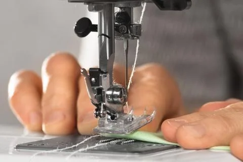 The operation of the sewing machine Stock Photos