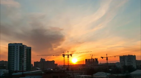 Operation of tower cranes in the evening with cloudy sky Stock Footage 52338827