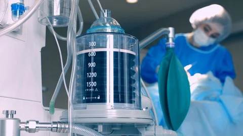 The operation of the ventilator piston, against the background of a doctor Stock Footage 129573548