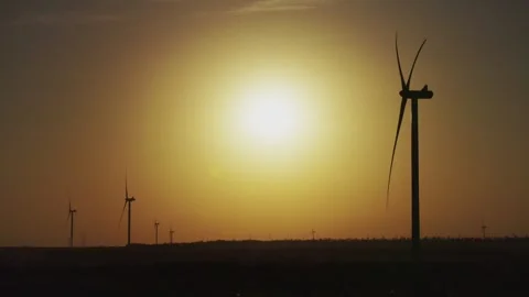 Operation of a wind power plant at sunset. Clean Energy.  Stock Footage 288194052