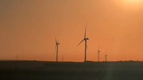 Operation of a wind power plant at sunset. Clean Energy.  Stock Footage 288194055