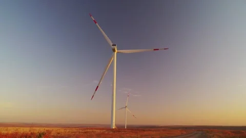 Operation of a wind power plant at sunset. Clean Energy.  Stock Footage 288194056