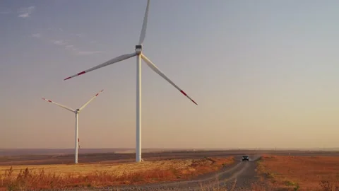Operation of a wind power plant at sunset. Clean Energy.  Stock Footage 288194058