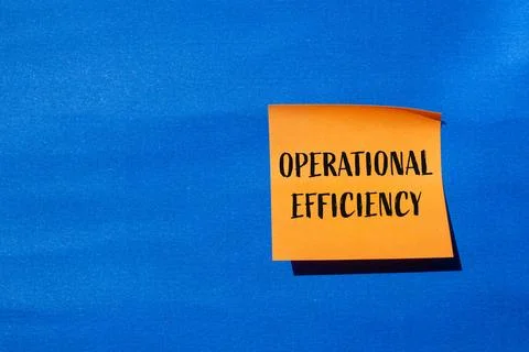 Operational efficiency message written on orange paper with blue background.  Stock Photos