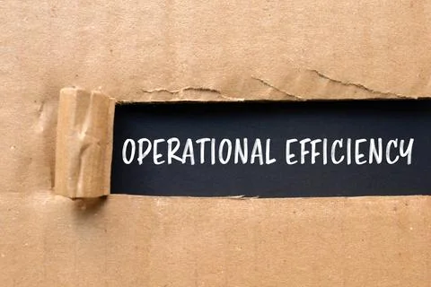 Operational efficiency message written on ripped cardboard paper with black b Stock Photos
