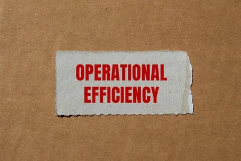 Operational efficiency message written on ripped paper piece with cardboard b Stock Photos