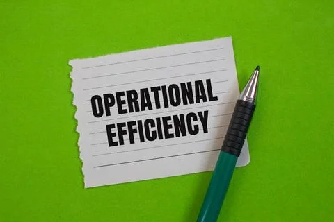 Operational efficiency message written on ripped paper piece with greenbackgr Stock Photos