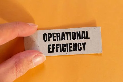 Operational efficiency message written on ripped paper piece with orange back Stock Photos