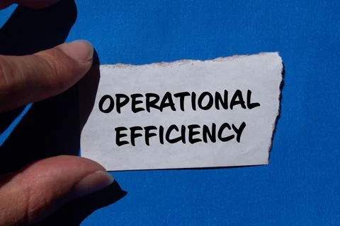 Operational efficiency message written on ripped torn paper with blue backgro Stock Photos
