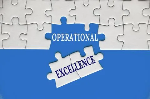 Operational Excellence text on missing jigsaw puzzle with blue cover background Stock Photos