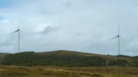An operational wind farm on a Hebridean moor Stock Footage 332155751