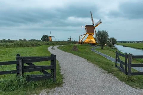 Operational windmill a night Stock-Fotos