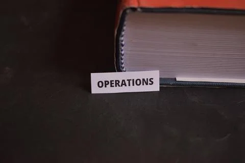 Operations Paper Tab Inserted in Book Pages Symbolizing Process Management Stock Photos
