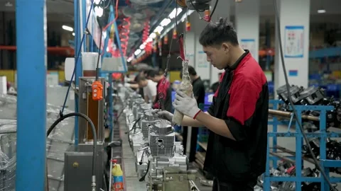 Operator Adjusts Shiny Steel Gearbox Mechanisms Inside Motor Assembly Line Stock Footage 337920783