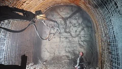 Operator Applying Shotcrete in Tunnel Construction and Industrial Work Stock Footage 332153201