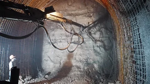 Operator Applying Shotcrete in Tunnel Construction and Industrial Work Stock Footage 332155310