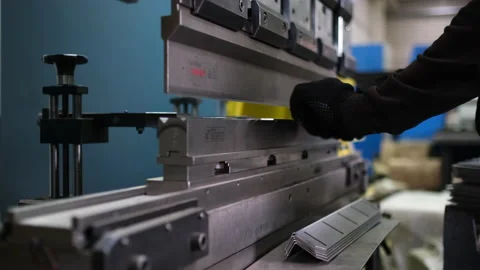 Operator bending metal sheet by sheet bending machine Stock Footage 153580840