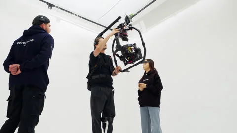 Operator carefully glides on hoverboard filming test scene Video stock 308952214