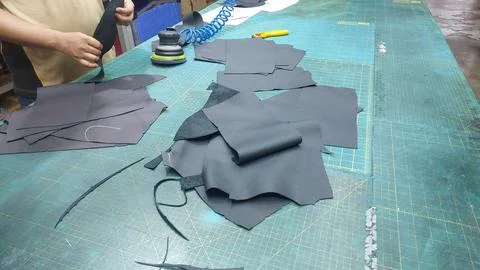 Operator cleans the marker pen ink on the surface leather. Stock Photos