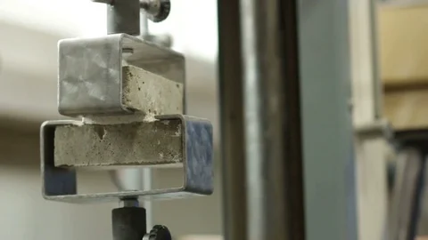 Operator Conducts Test on Cement Strength Video stock 72680288