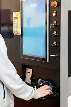 Operator at the control panel  of CNC machine Stock Photos