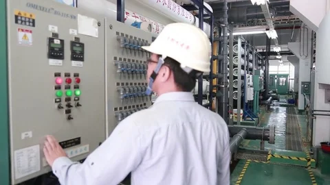 An operator is controlling the reverse osmosis system in a water plant. Stock Footage 72927246