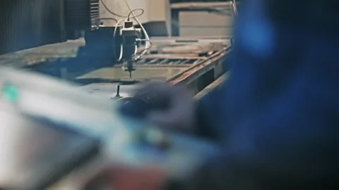 Operator Controlling Waterjet Cutting Machine in Industrial Production Plant Stock Footage 346656721