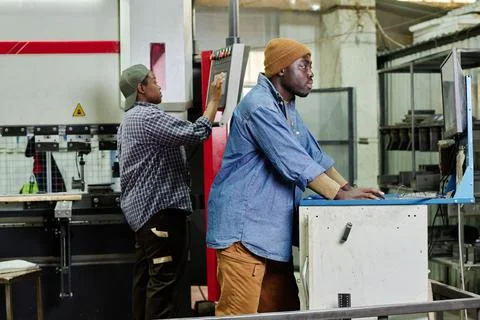 Operator controlling the work of machine Stock Photos