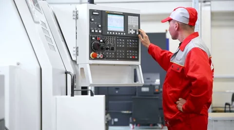 Operator controls the CNC machine Stock Footage 62898704