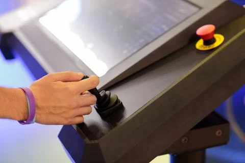 Operator controls equipment with joystick Stock Photos