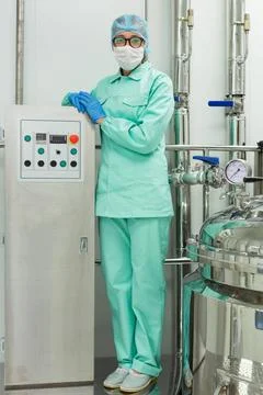 The operator controls the machine in the factory work plant picture, clean... Stock Photos