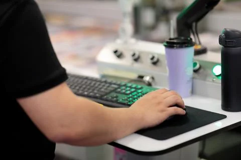 Operator controls modern computerized equipment Stock Photos