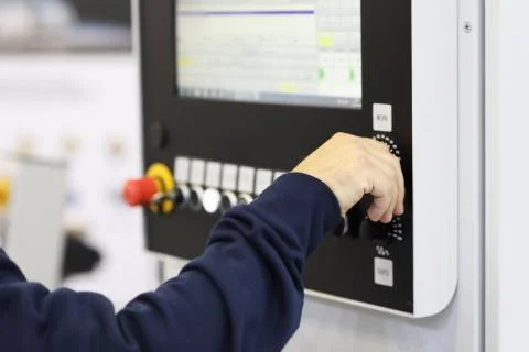 Operator controls the work of the CNC machine Stock Photos