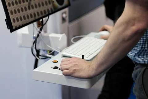 Operator controls x-ray and CT inspection system Stock Photos