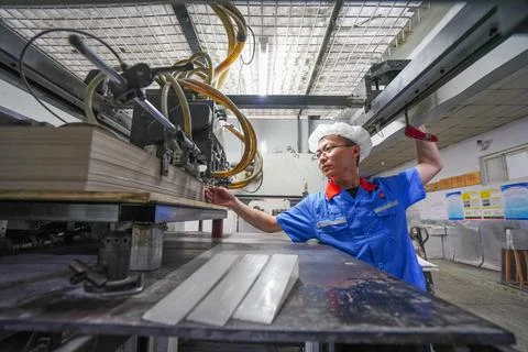 Operator Debugging Printing Equipment and Monitoring Paper Printing Stock Photos